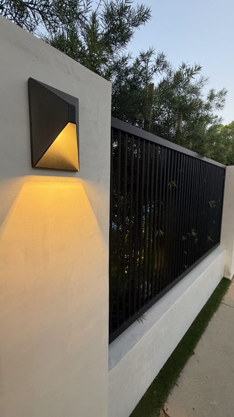 Metal gate set into a stucco wall