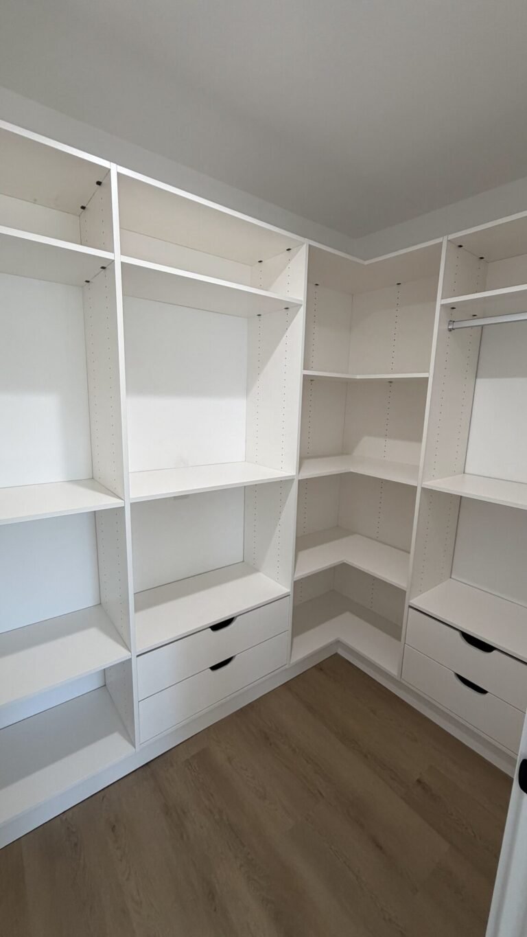 Custom closet built-ins with shelving and drawers