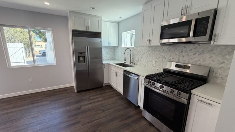 White shaker cabinets with a stainless gas range
